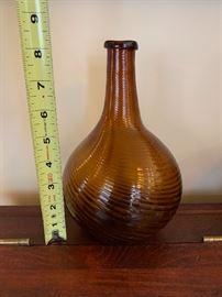 Antique swirl glass glob, honey amber color with folded lip, c.a. 1830. 8 1/4” tall