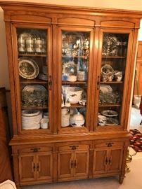 China cabinet displays "Friendly Village" dishes & glassware, and Pfaltzgraff Christmas set of dishes