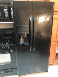 Side-by-side black refrigerator/freezer
