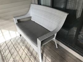 Like new faux wicker outdoor settee-$45. Brand new indoor outdoor toss pillows are also for sale