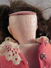 MARKINGS ON THE BACK OF THE HEAD OF THE ARMAND MARSEILLE NOBBIKID OR GOOGLY EYE PORCELAIN DOLL