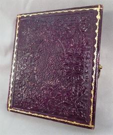 GILT AND EMBOSSED LEATHER EXTERIOR OF ANTIQUE AMBROTYPE CASE 