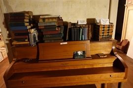 Gordon Laughead piano with antique books. 