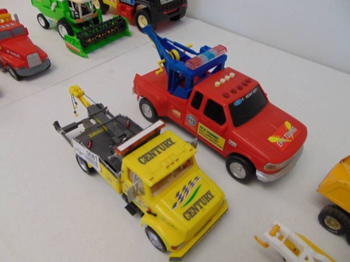 4 various tow trucks