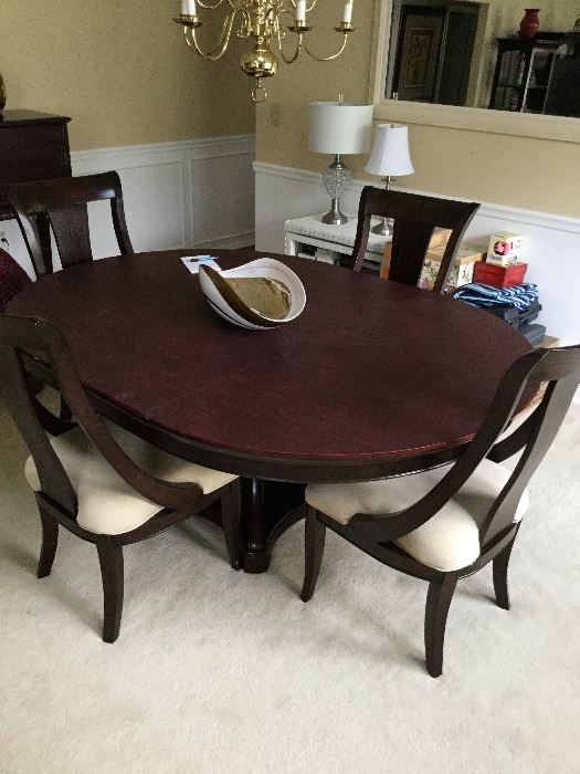 Dining table . Includes one leaf and 4 chairs $2000