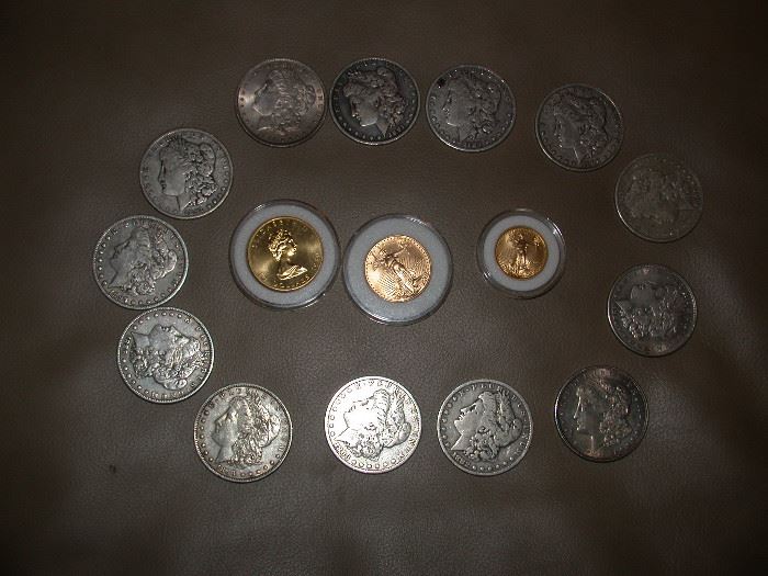 Morgan silver dollars and 3 gold Maple leaf coins