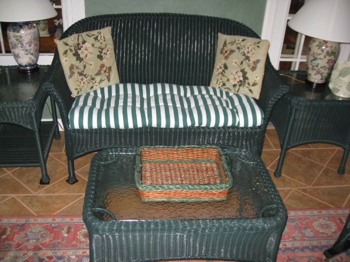 another "wicker" settee, coffee table, and end table