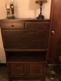 Storage cabinet. Middle door drops down.