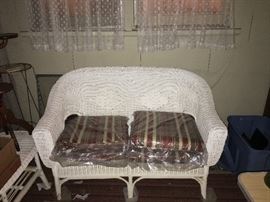 Wicker patio furniture - besides this piece includes 2 chairs and 2 small tables