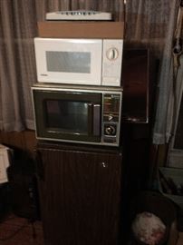 Mini refrigerator and 2 microwaves