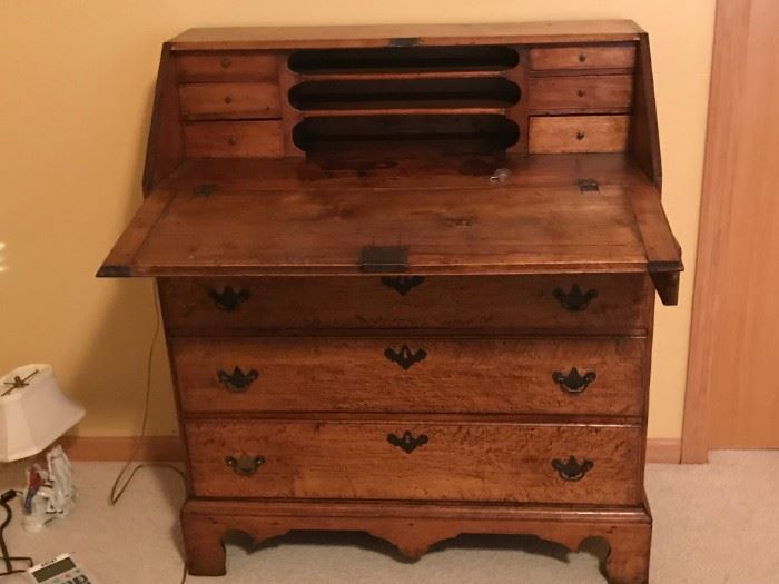 Chippendale Period, 1770-1790  slant lid desk.   Most likely American made from New England.  The piece is primarily bird's eye maple.  It has an old refinish and replaced brasses.  