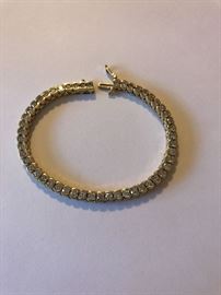 Diamond tennis bracelet. 51 diamonds in total. Estimated at 1/8 ct - 1/6 ct. each set into 14 kt gold.