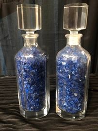 Glass bottle with blue glass shards