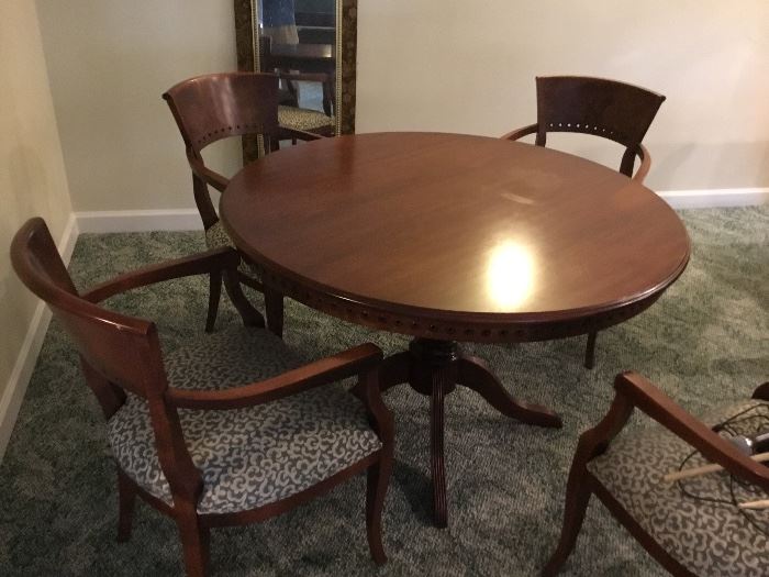 Great round game or dining table and chairs.