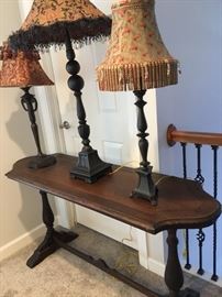 Antique console table and lamps.