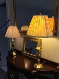 Demilune table, lamps and mirrors.