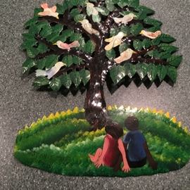 Signed metal artwork.