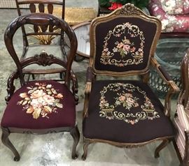 Antique wood chairs with needlepoint seats.