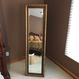 Bassett Mirror Co. full-length mirror with ornate frame.