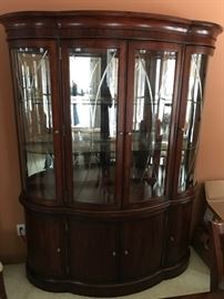 Large lighted china cabinet that matches the dining room cabinet.