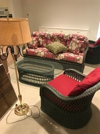 Wicker furniture set: couch, two chairs and glass-top table.  Has been used inside.