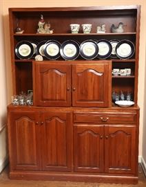 Handsome cabinet showing set of fish plates.