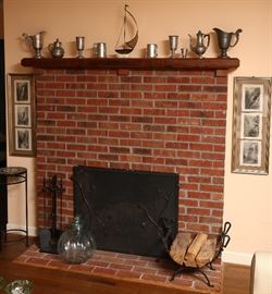 Living room fireplace with unusual fire screen.
