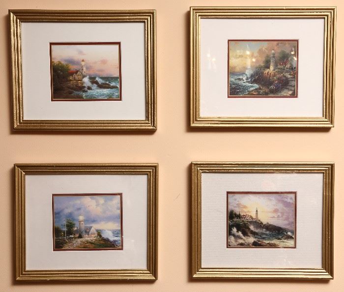 Four lighthouse framed prints.