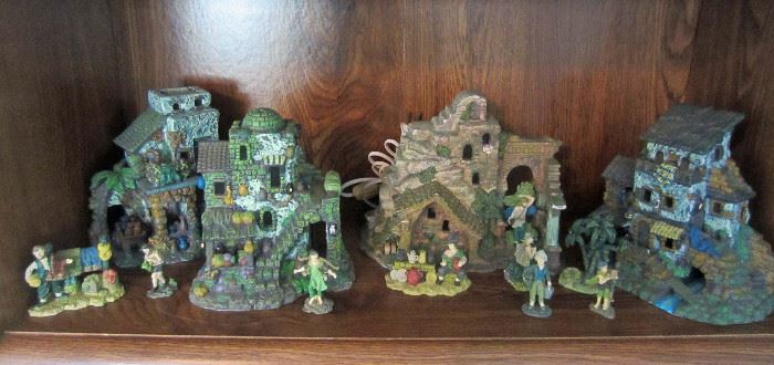 Unusual ceramic houses  and figures (note light cord)