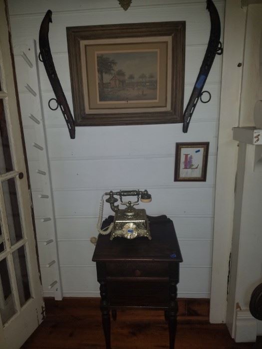 Antique horse tack, vintage phone, small antique table