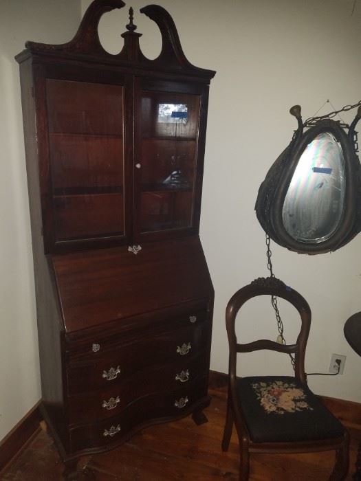 Antique secretary, antique horse collar converted to mirror, needlepoint seat Victorian chair