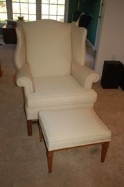 High back cushioned chair with ottoman