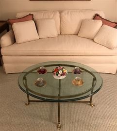White sofa & brass and glass coffee table