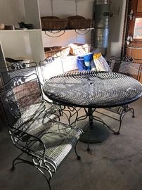 Vintage wrought iron patio table, 4 chairs and umbrella