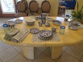 Dining Room Table, Contemporary Styling & Light Lacquer Finish. Size: 48" X 64". Includes 2-18"Leaves. On Back Wall are 6-Side Chairs sold as a separate group