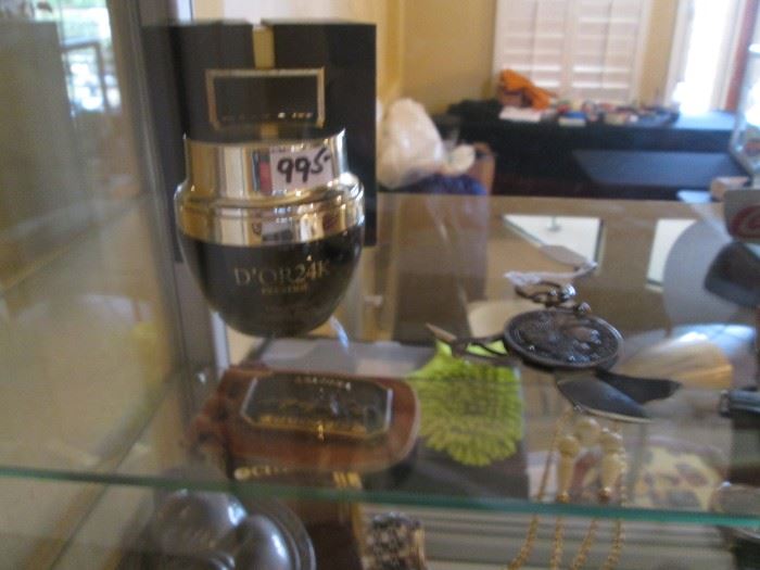 On the Right is a 5 Franc Coin, 1851, Key Chain, with Pocket Knife, Cigar Cutter, Scissors.                                               Back Left is D'OR24K "Prestige" Detoxifying Mask,       1-JAR ONLY PRICED $995.  This is NOT a TYPO!