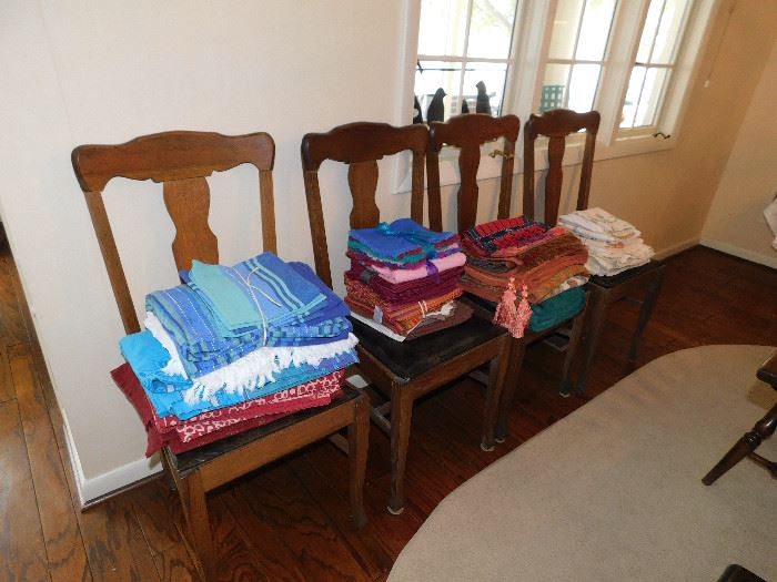 4 Oak chairs. Colorful table linens.