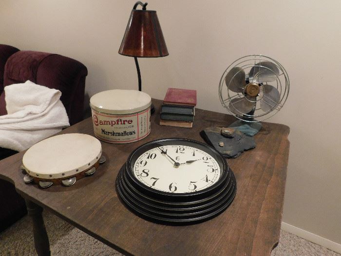 Vintage table, electric fan, tambourine and Campfire Marshmallow tin