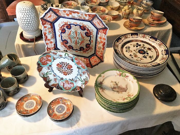 The large square Imari plate is an antique, as are the fish plates.
