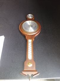 Mahogany Barometer; Made in Germany; Marked "Jason"; Displays Humidity, Temperature (F), & Weather on a Scale of Stormy to Dry; 9"W x 1"D x 28"H; $50; ref #: 18787