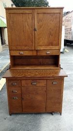 Hoosier Cabinet; Made of Oak Wood; 2 Piece (Top can be Moved); Numerous Drawers & Doors; Made by Shengel; 39"W x 23"D x 52"H; $500; ref #: 19975