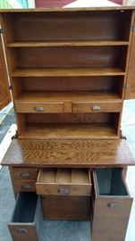 Hoosier Cabinet; Made of Oak Wood; 2 Piece (Top can be Moved); Numerous Drawers & Doors; Made by Shengel; 39"W x 23"D x 52"H; $500; ref #: 19975