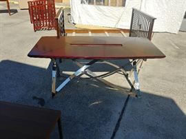 Chrome Base Dining Table; Twisted Chrome Base
Mahogany Top; Slot for Glass Insert (Not Included); 72"W x 36"D x 31"H; $750; ref #: 926