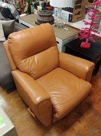 Burnt Orange Recliner; Made of Bonded Leather; Swiveling Base; Manual Recline Lever; 39"W x 42"D x 42"H; $180; ref #: 1
