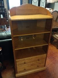Corner Bookcase; It Does Roll; 3 Shelves, 2 Drawers; 34"W x 16"D x 63"H; $200; ref #: 1