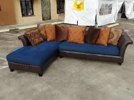 2 PC Denim Sectional; Denim Upholstered Cushion;
Leather Upholstered Frame; Comes w/ 8 Pillows; 125"W x 87"D x 30"H; $800; ref #: 1