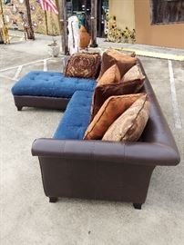 2 PC Denim Sectional; Denim Upholstered Cushion;
Leather Upholstered Frame; Comes w/ 8 Pillows; 125"W x 87"D x 30"H; $800; ref #: 1
