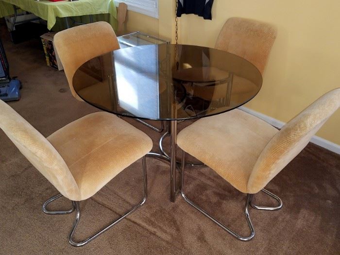 Glass table and four chairs