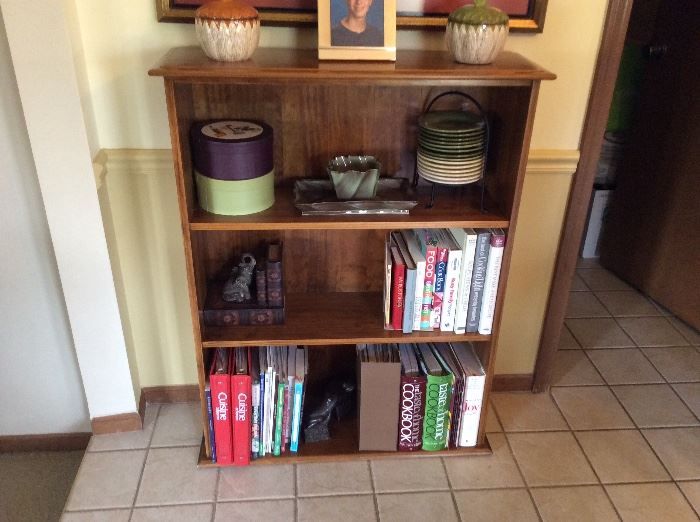 one of many bookcases and all the decor you see