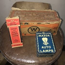 Assorted vintage automobile lamps.